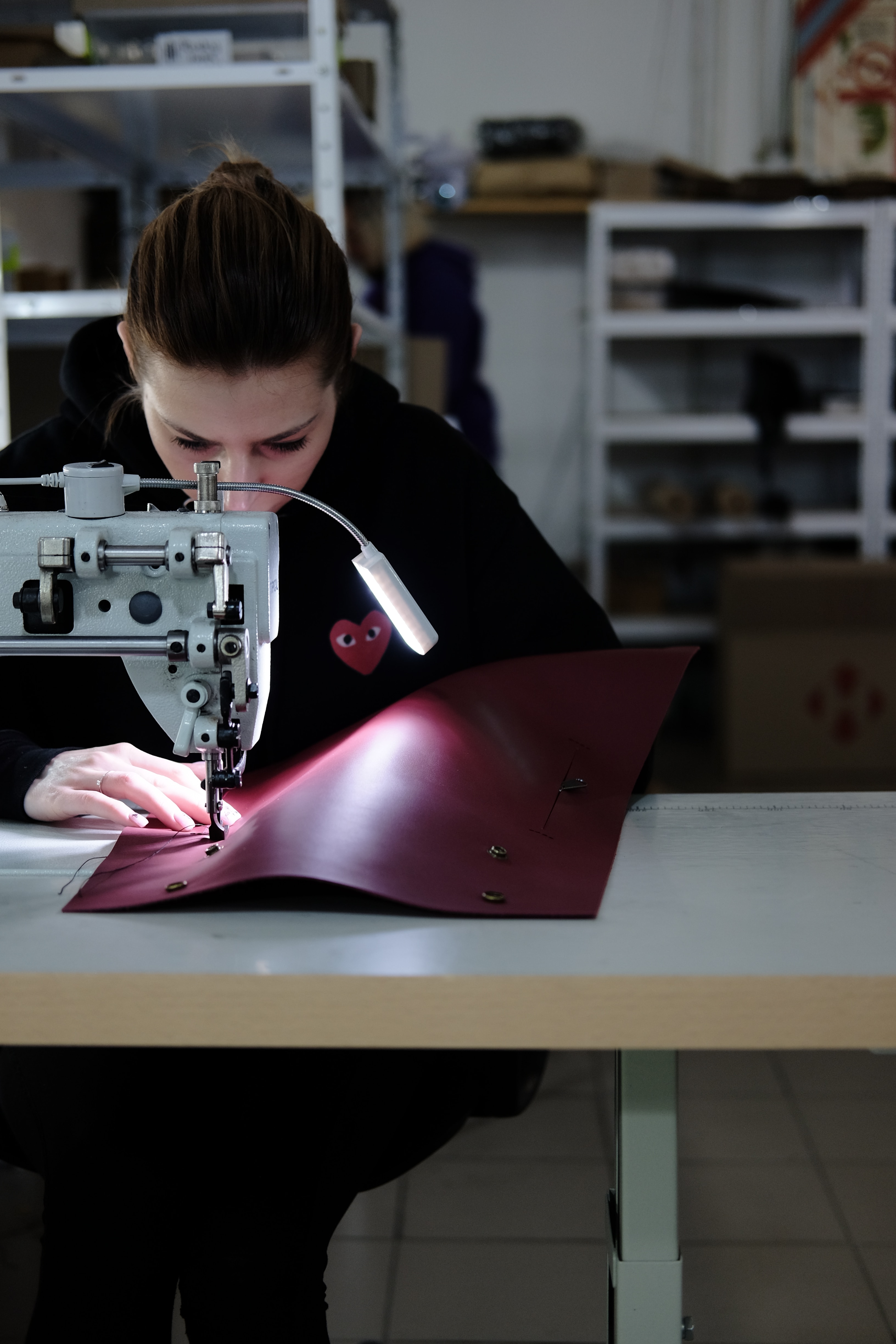 Student at sewing machine