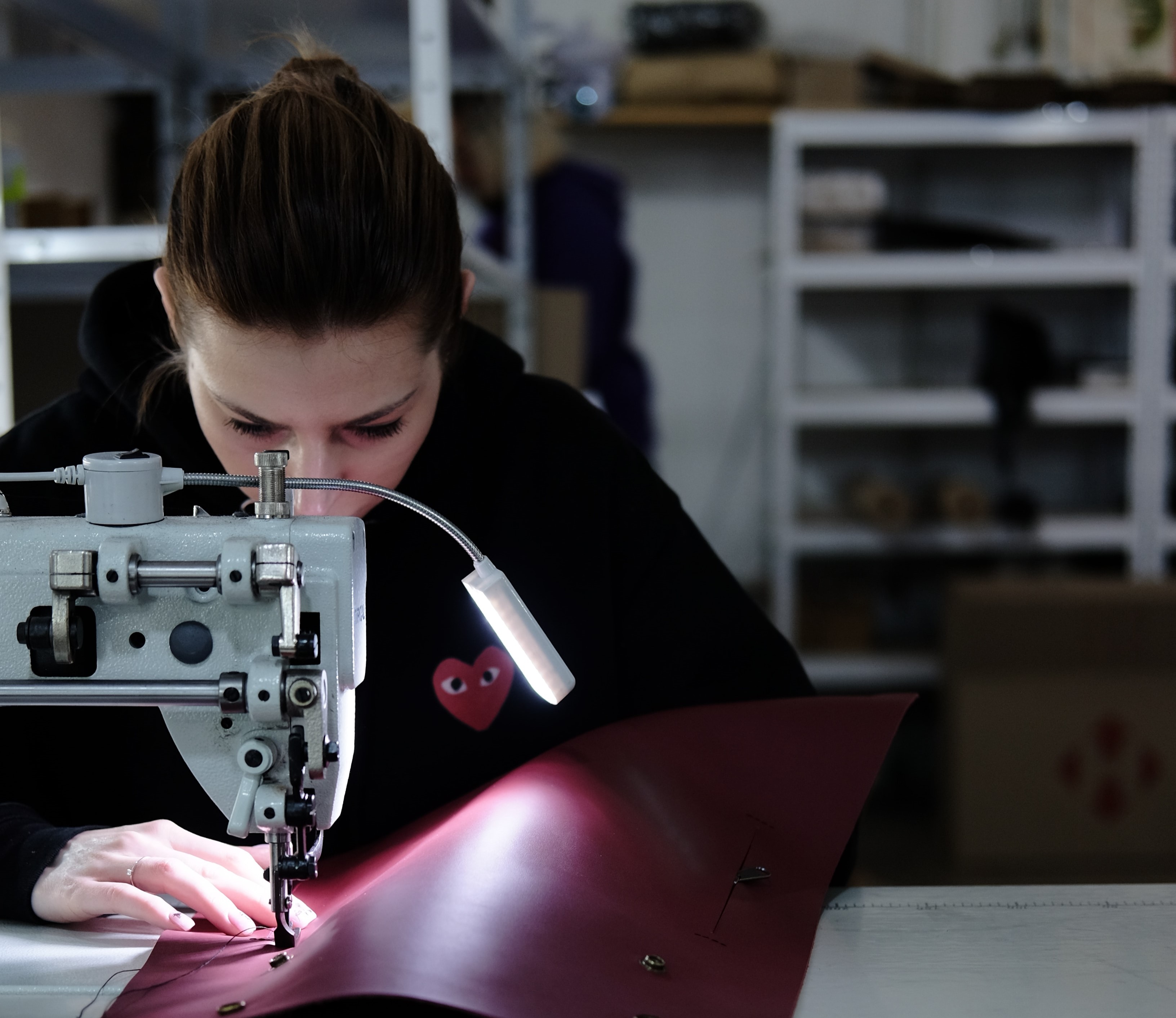 Student at sewing maching