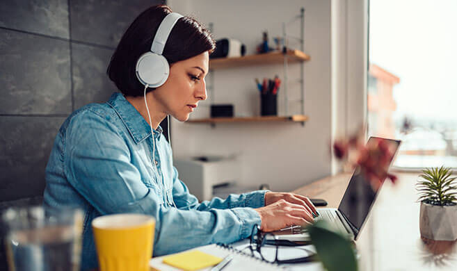 woman typing on her computer at home - ©kerkezz / Adobe Stock