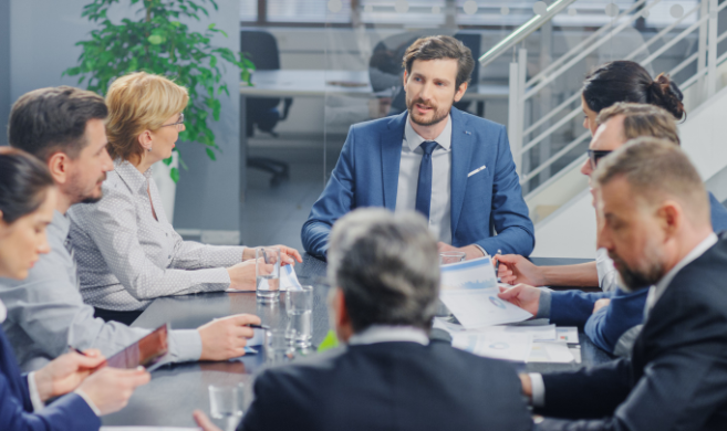 a diverse board discussing in a meeting room - cover