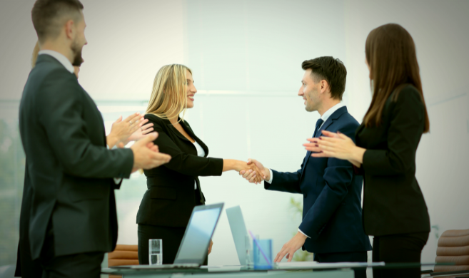 woman shaking hands of a team_cover